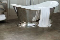 modern stone effect lvt flooring with a steel freestanding bathtub